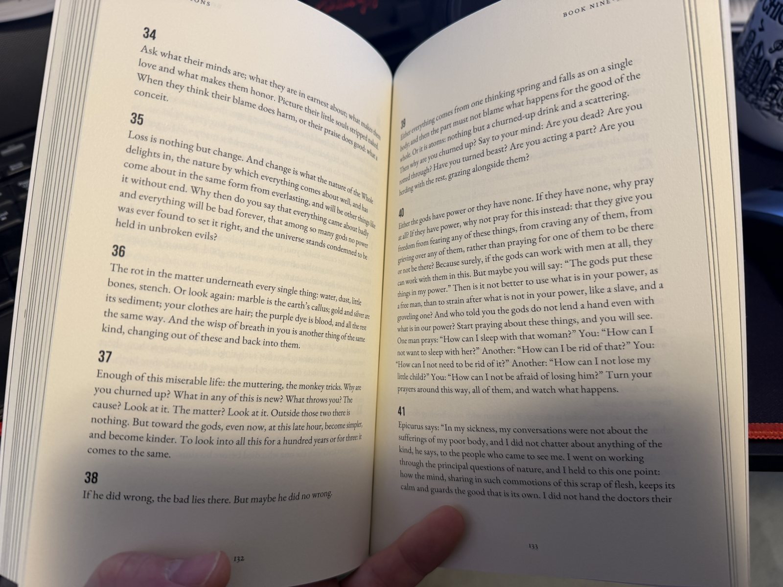 The printed Meditations held open at Book Nine